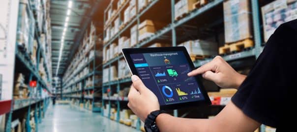 A warehouse manager tracks internal orders on a tablet