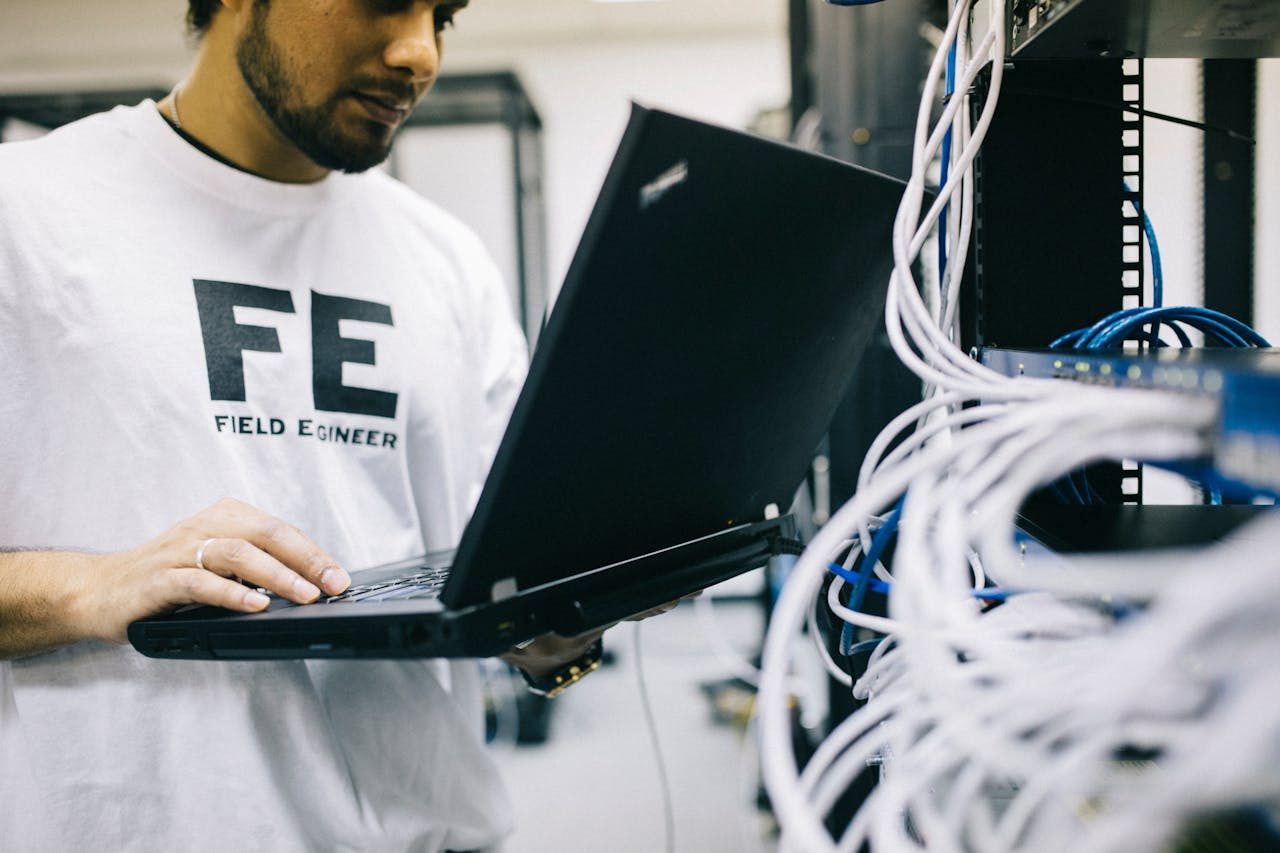 field engineer examining telecom equipment